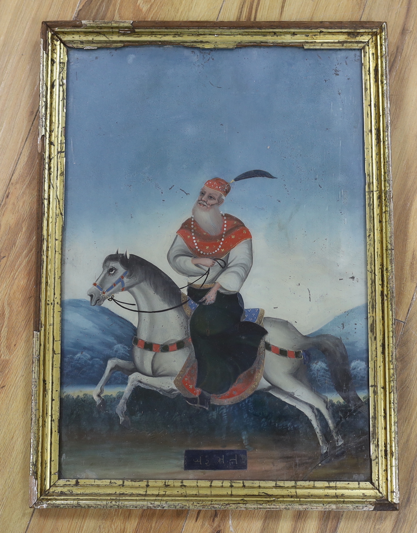 19th century Indian School, reverse glass painted panel, Rider on horseback, 49 x 33cm